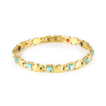 Celeste gold-plated stainless steel bracelet with blue crystals clasped front view, heart-link design.